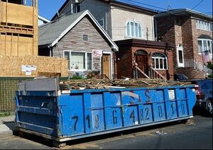 construction dumpster placed outside a home building site